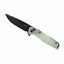 Folding knife with black blade and translucent handle on a white background