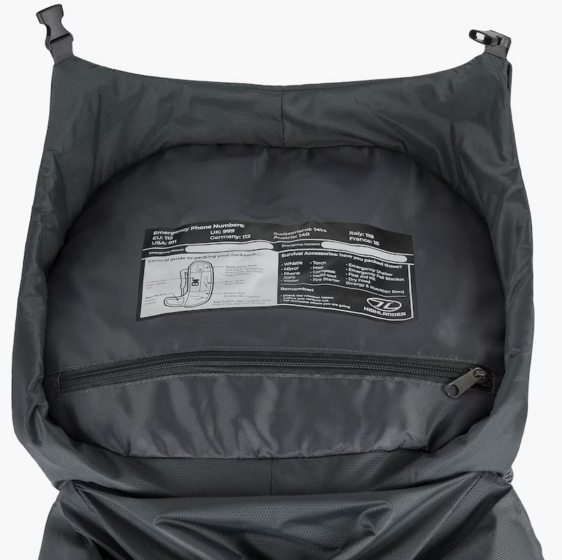 Back of a black backpack with a label on a white background