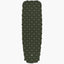Green quilted sleeping pad on a white background