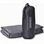 Gray sleeping bag liner with drawstring bag on a white background
