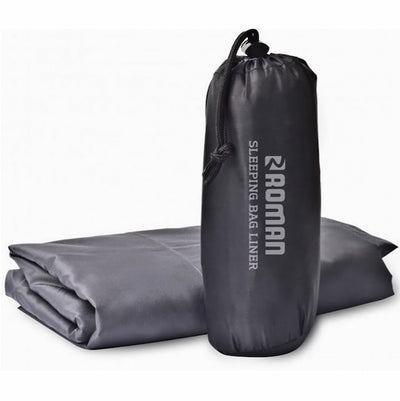 Gray sleeping bag liner with drawstring bag on a white background