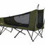 Green camping hammock with mesh sides on a white background