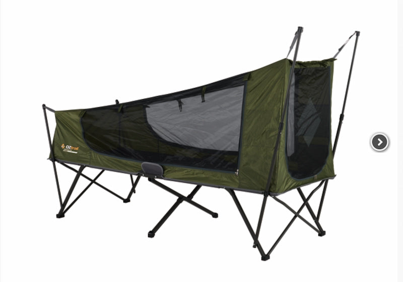 Green camping hammock with mesh sides on a white background