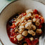 Close-up of a dessert with crumble topping in a bowl