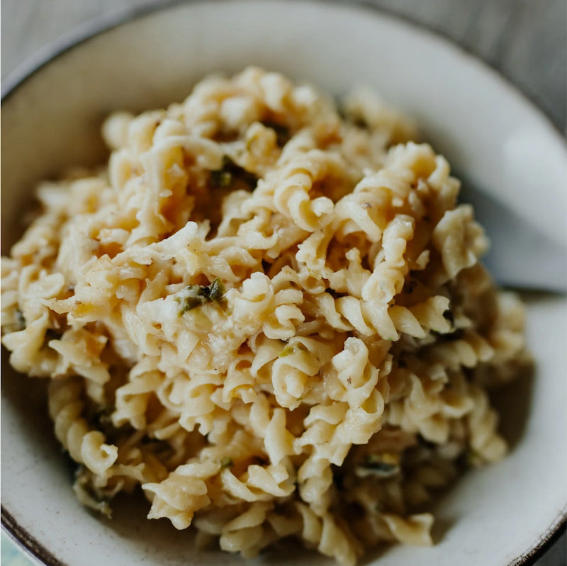 Close-up of a bowl of pasta with a blurred background