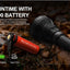 Acebeam flashlight with 21700 battery on a forest floor background