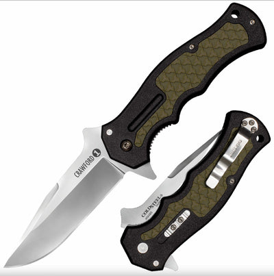 Two folding knives with black and green handles on a white background