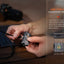 Person holding a device with USB Type-C charging port on a blurred background
