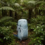 Light blue backpack in a dense forest