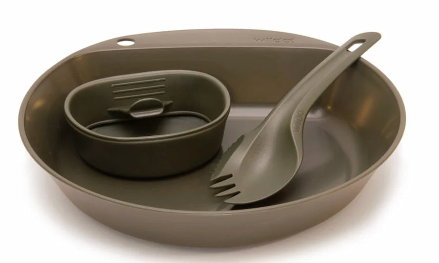 Green camping cookware set with pan, pot, and utensils on a white background