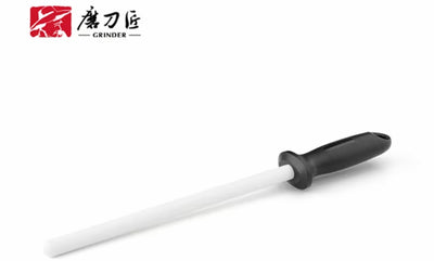 Knife sharpener with black handle and white blade on a white background, featuring the brand '磨刀匠'.