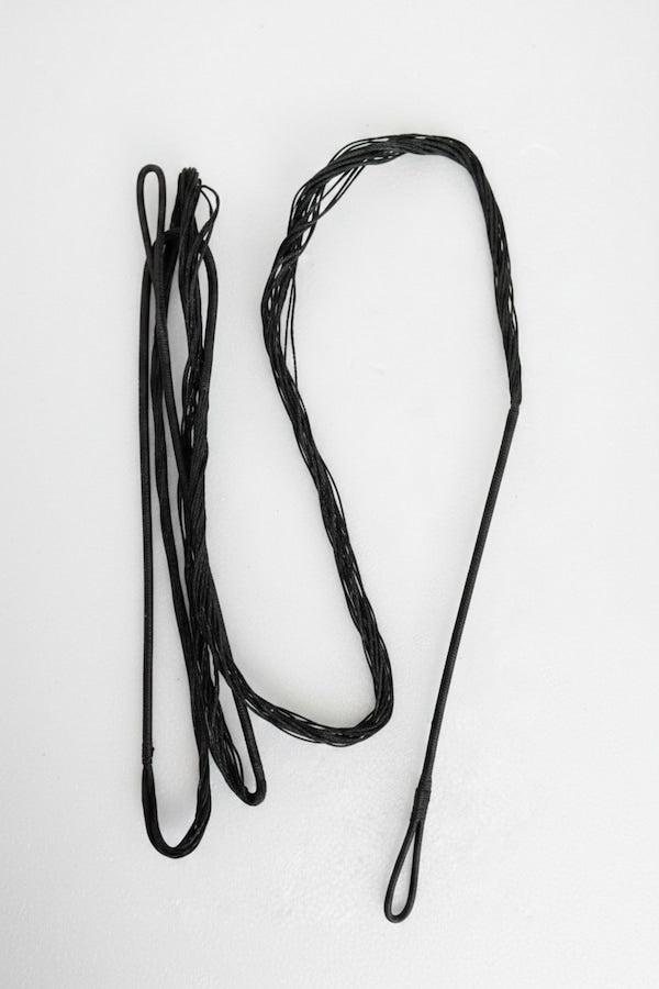 A of set three black rope or cord accessories with looped ends, laid out on a plain white background.