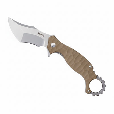 a closed folding knife with tan handle on a white background