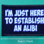 Patch with text 'I'm just here to establish an alibi' on a green background