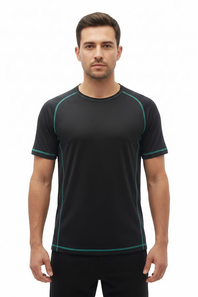 Man wearing a black athletic shirt with green accents on a white background