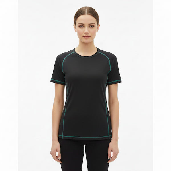 Woman wearing a black athletic shirt with green accents on a white background