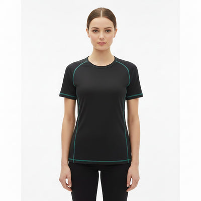Woman wearing a black athletic shirt with green accents on a white background