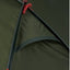 Close-up of a green tent with red ropes and poles.