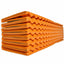 Stack of orange foam rollers on a white background