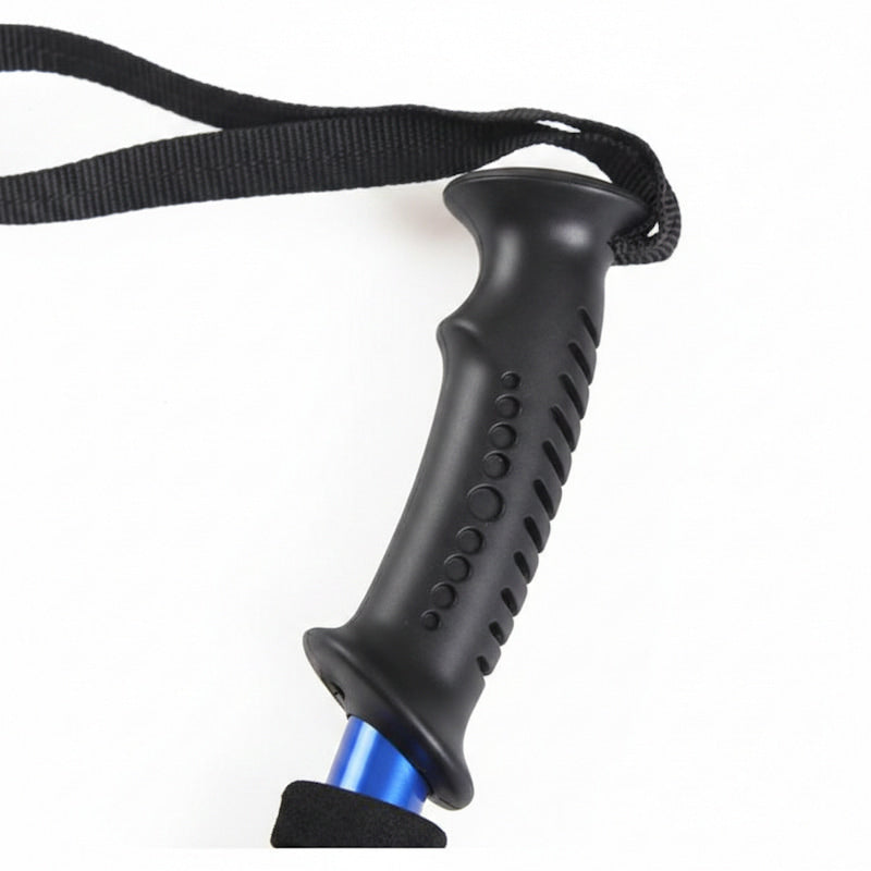 Close-up of a black textured hiking pole handle with a black wrist strap and a blue metal section visible below, on a white background.