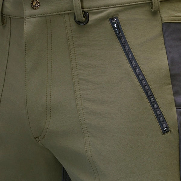 Close-up of green pants with a zipper detail