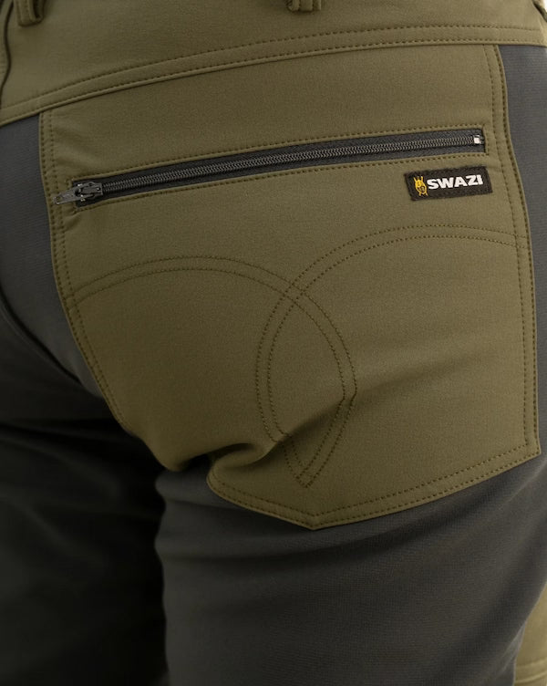 Close-up of a green jacket with a zipper pocket and 'Swazi' brand logo.