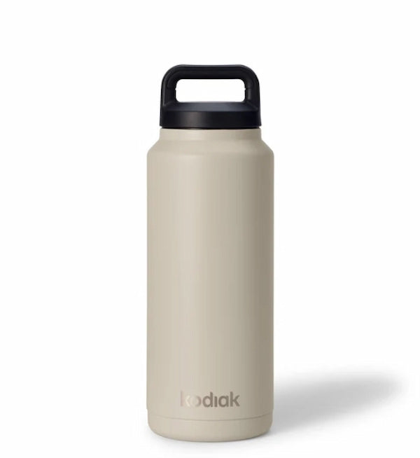 Beige water bottle with black lid on a white background