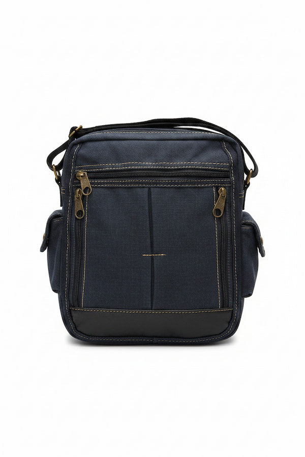 A navy blue canvas crossbody bag with gold-tone hardware and contrast stitching, shown against a plain white background.