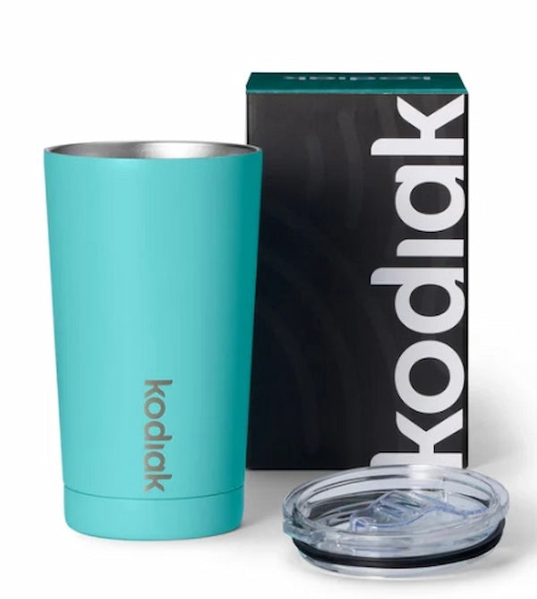 Turquoise tumbler with clear lid and Kodiak branding next to a black Kodiak box on a white background