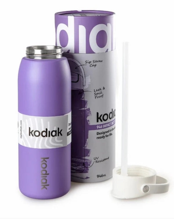Purple insulated tumbler with white straw and packaging on a white background