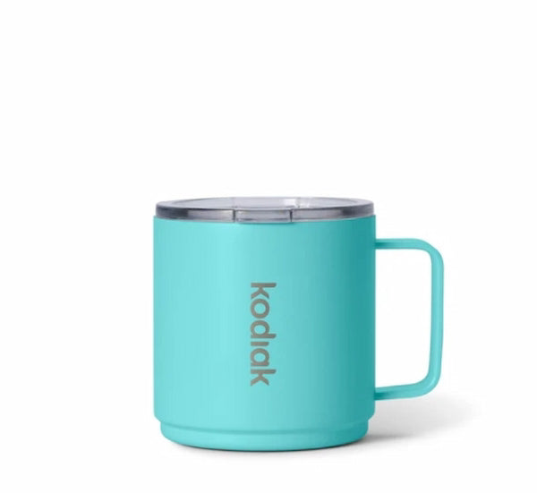 Turquoise mug with 'kodak' branding on a white background