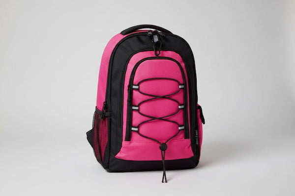 Pink and black backpack on a light gray background