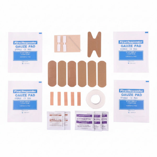 A FirstResponder gauze pad and wound care kit laid out on a white background, including multiple sterile gauze pads, beige adhesive bandages, a roll of white tape, small antiseptic wipes, and a sterile pipe.