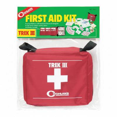 Coghlan's Trek III First Aid Kit in a red zippered pouch with a white cross, packaged in a clear plastic bag with a green and yellow header card.