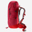 A red hiking backpack with gray padded shoulder straps and side buckles, shown from the side on a light gray background.