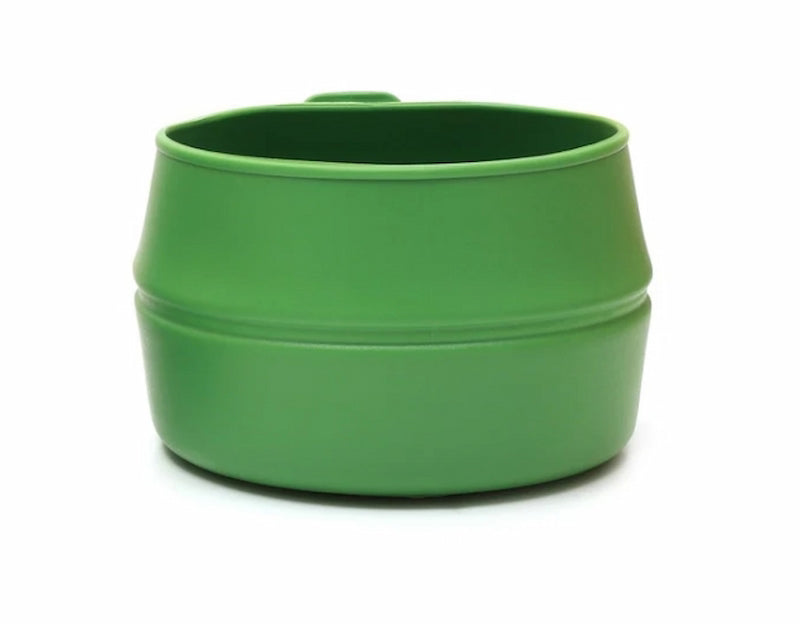 Green plastic cup with handle on a white background