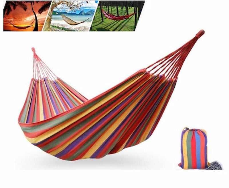 Colorful striped hammock with carrying bag on a white background