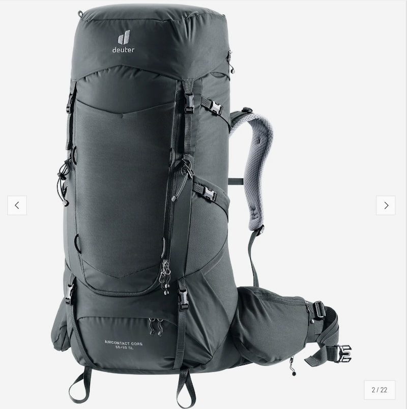 A dark gray Deuter backpack shown on a light gray background, with a matching side pouch attached. The backpack features multiple zippered compartments, compression straps, and padded shoulder straps.