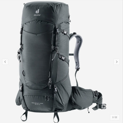 A dark gray Deuter backpack shown on a light gray background, with a matching side pouch attached. The backpack features multiple zippered compartments, compression straps, and padded shoulder straps.