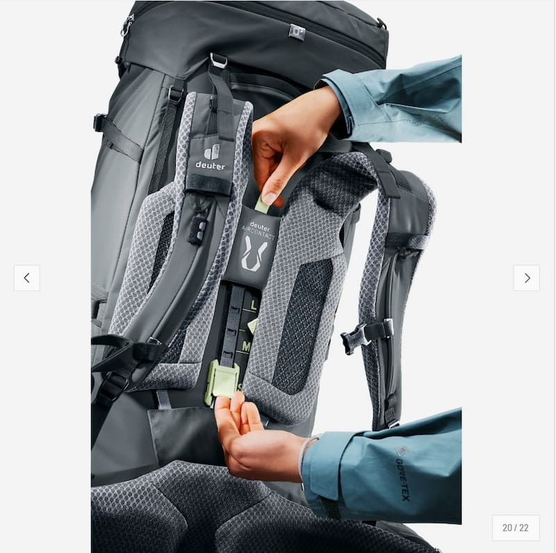 Gray hiking backpack with a person adjusting the straps on a white background