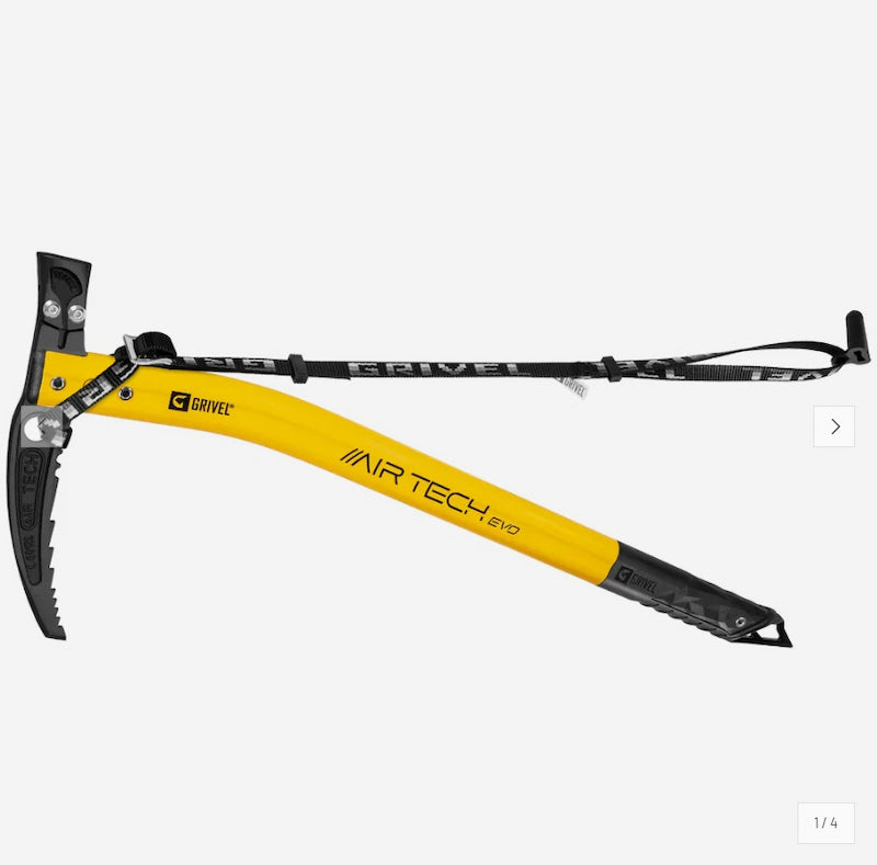 A yellow and black ice axe with a long black handle and wrist strap, shown against a light gray background.