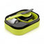 Set of green and gray cutlery in a container on a white background