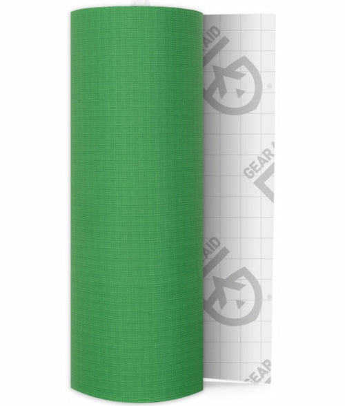 A roll of bright green mesh fabric or tape standing upright next to its white backing paper, which features a gray Gear Aid logo.