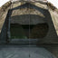 Camouflage tent interior with sleeping bags inside