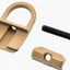 Tan metal D-ring and black screw on a white background