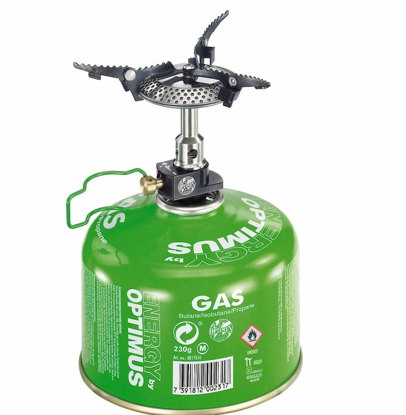 Optimus camping stove with green fuel canister on a white background