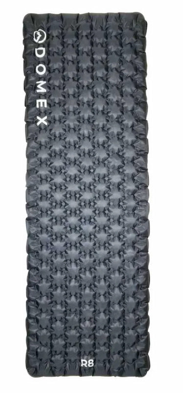 Gray sleeping pad with textured surface and 'Domex' branding on a white background