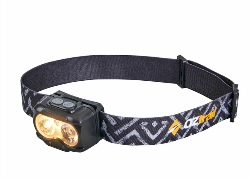 Headlamp with black strap featuring a pattern and 'Oztrail' branding on a white background