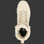 Beige boot with laces on a black background