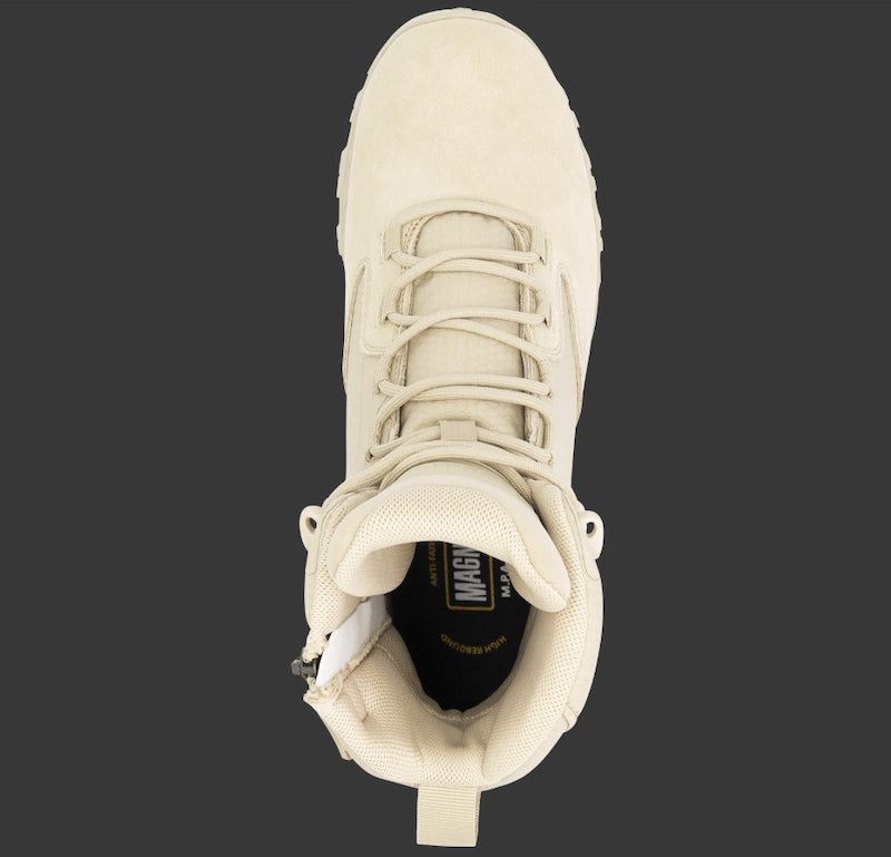 Beige boot with laces on a black background